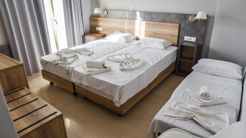 Postel nebo postele na pokoji v ubytování Hotel Coral