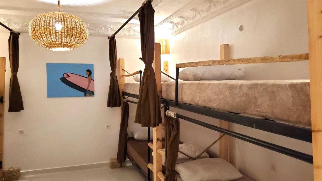 Postel nebo postele na pokoji v ubytování Kekai Surf House