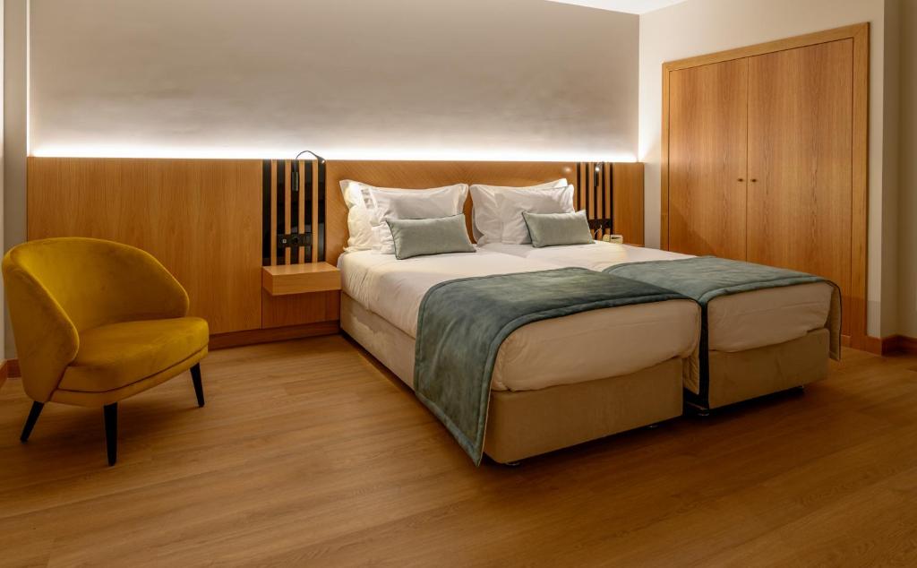 Postel nebo postele na pokoji v ubytování Santa Eufémia Covilhã Hotel