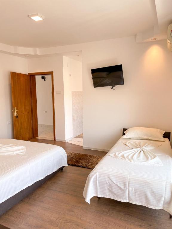 Postel nebo postele na pokoji v ubytování Casa Sinani