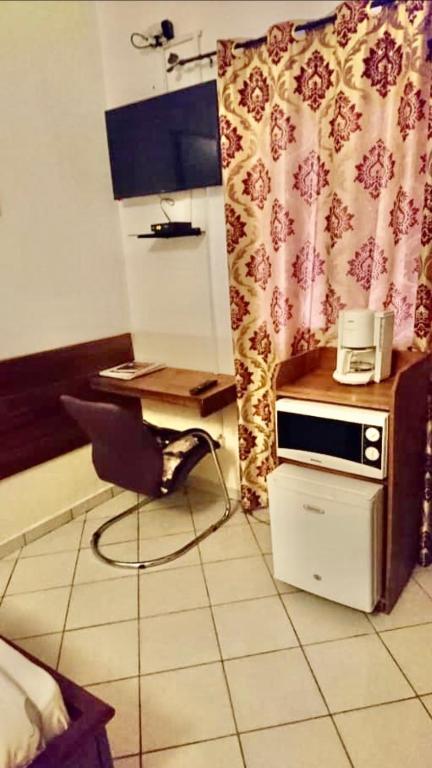 TV a/nebo společenská místnost v ubytování Résidence ARCHANGE