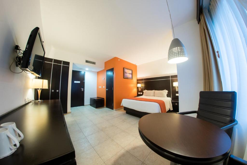 Postel nebo postele na pokoji v ubytování HOTEL OLIBA Boca del Rio
