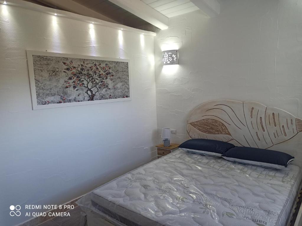 A bed or beds in a room at Bello Bello Rooms