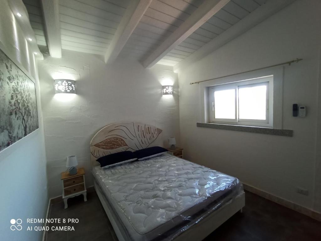A bed or beds in a room at Bello Bello Rooms