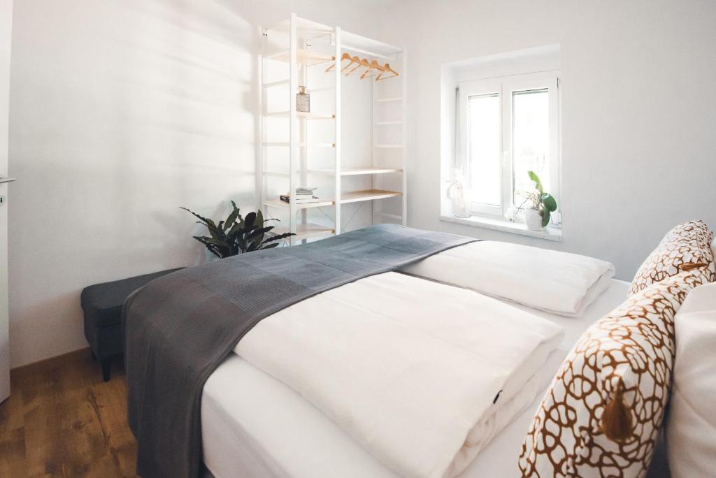 Ένα ή περισσότερα κρεβάτια σε δωμάτιο στο Kapuzini Livin‘