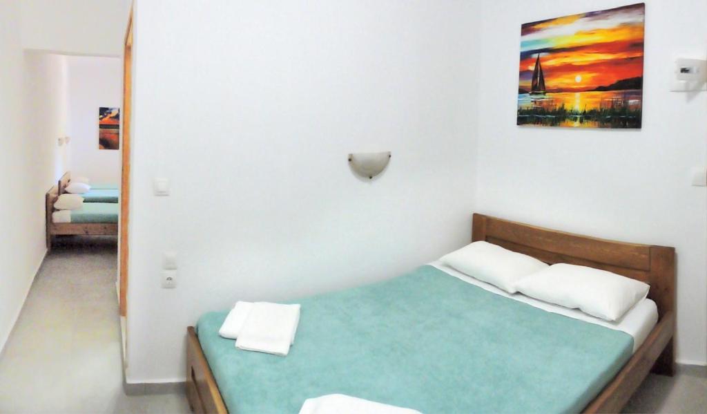 Postel nebo postele na pokoji v ubytování Egeon Rooms and Studios