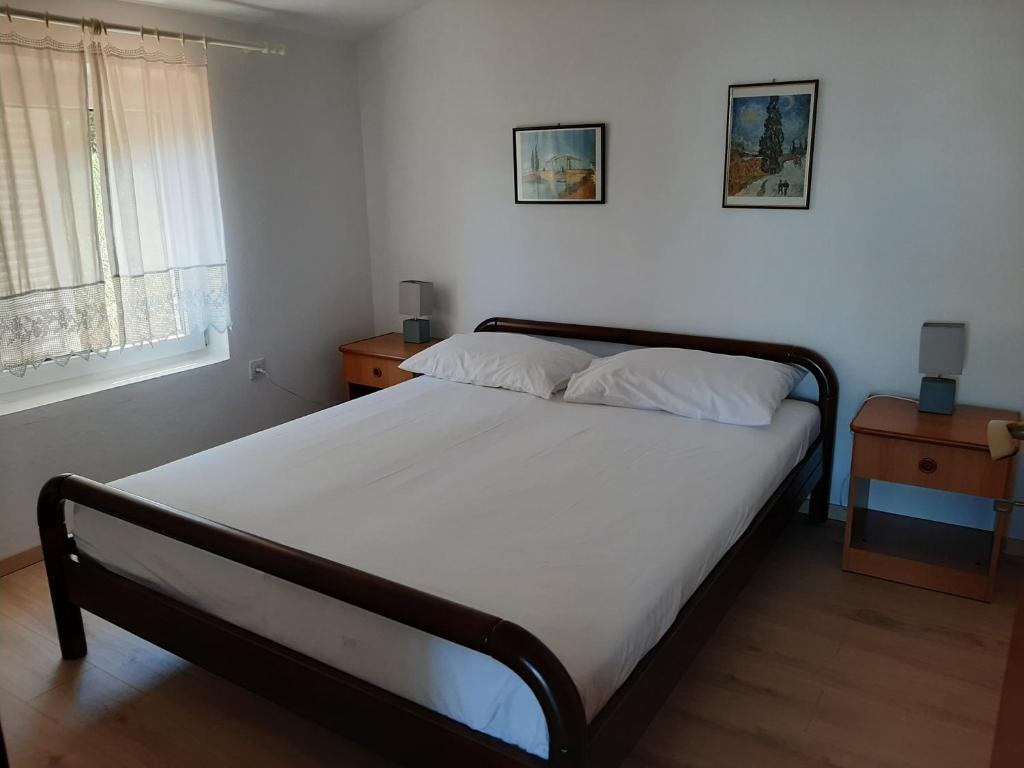Postel nebo postele na pokoji v ubytování Apartments Basina