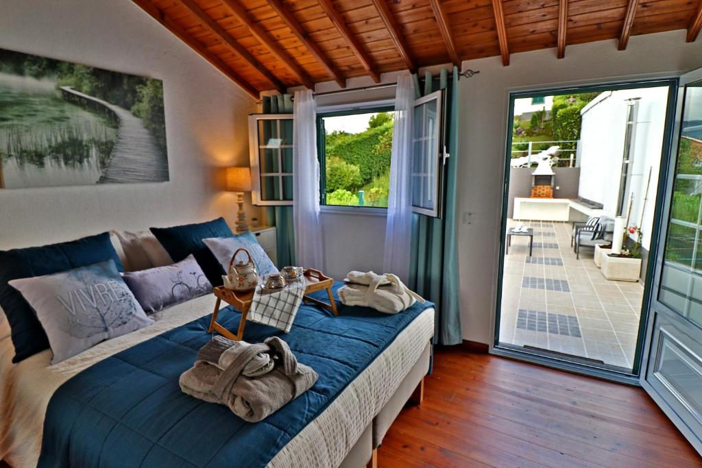 a bedroom with a bed with towels on it at Furnas Nook in Furnas