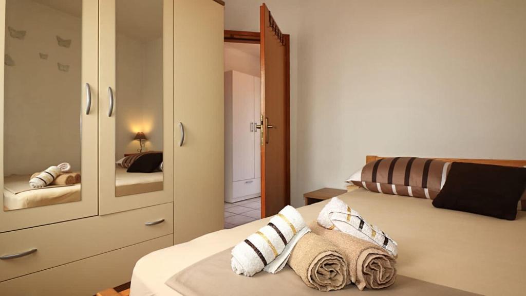 Postel nebo postele na pokoji v ubytování Apartmani Meri