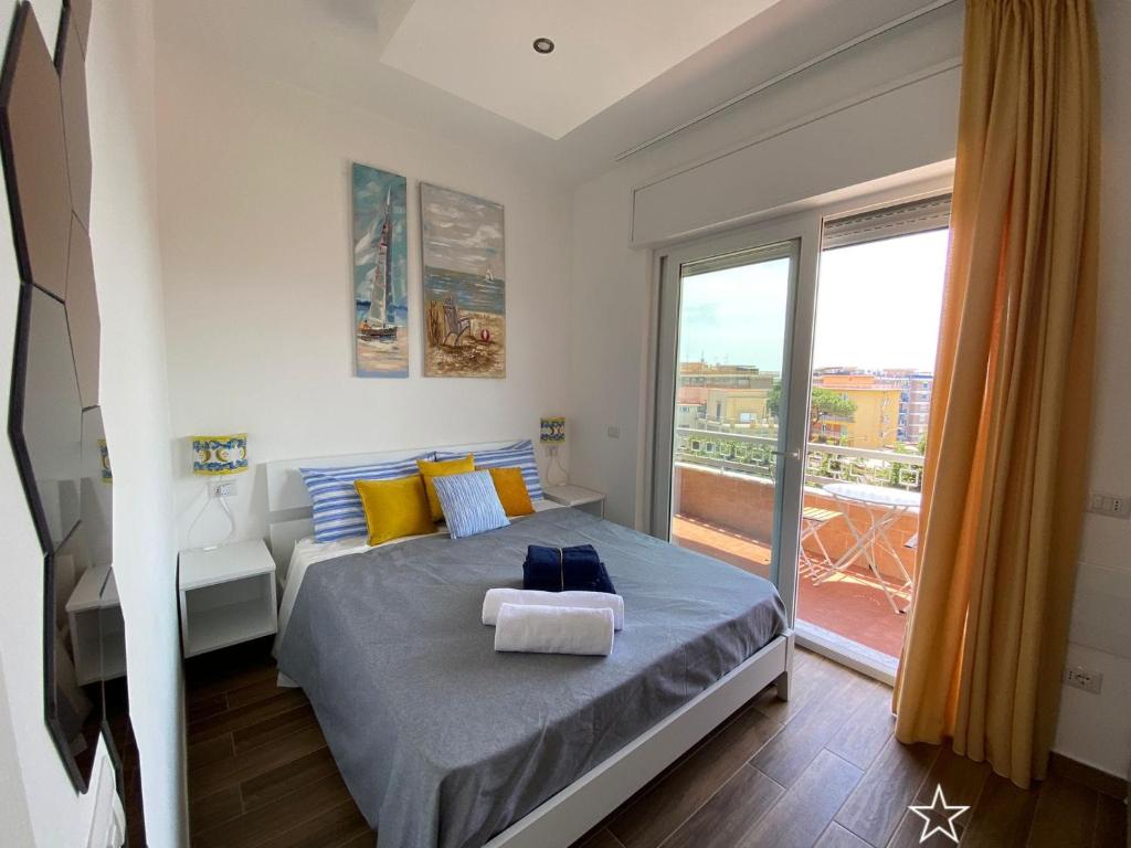 Кровать или кровати в номере B&b Animo Mediterraneo