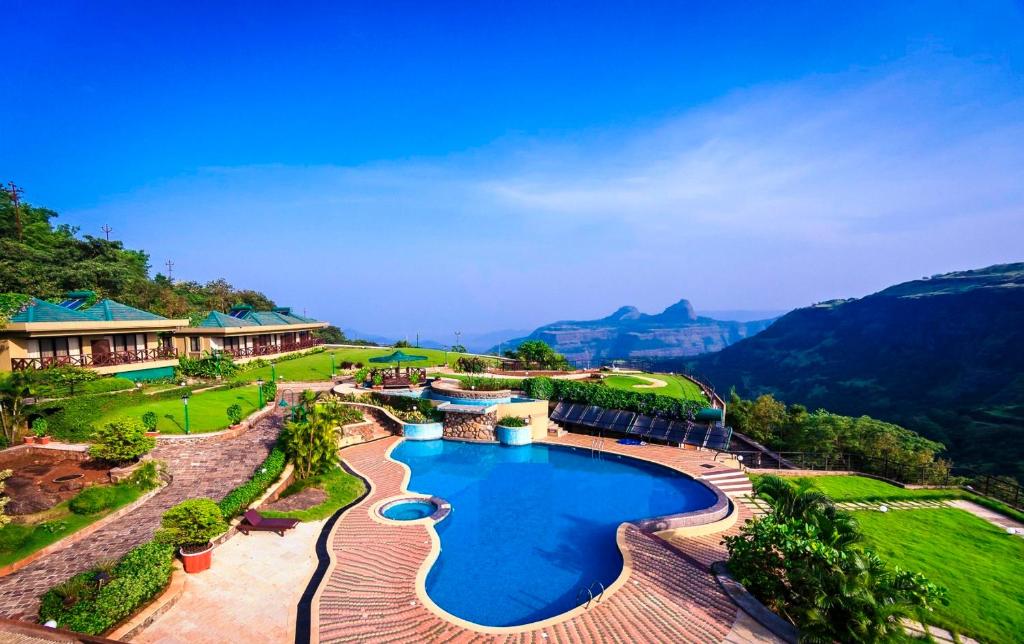 an aerial view of a resort with a swimming pool at Upper Deck Resort in Lonavala
