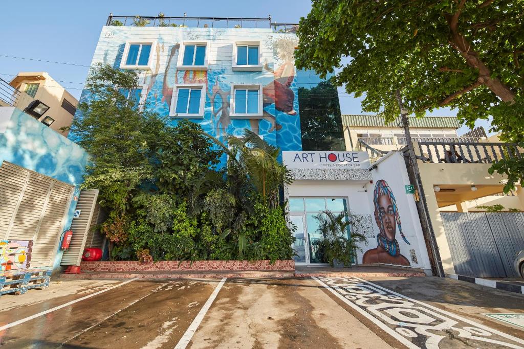 an empty street in front of a building at Art House in Luanda