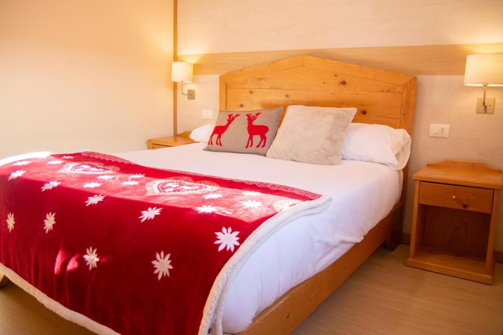 Abete Bianco - Albergo del Natale tesisinde bir odada yatak veya yataklar