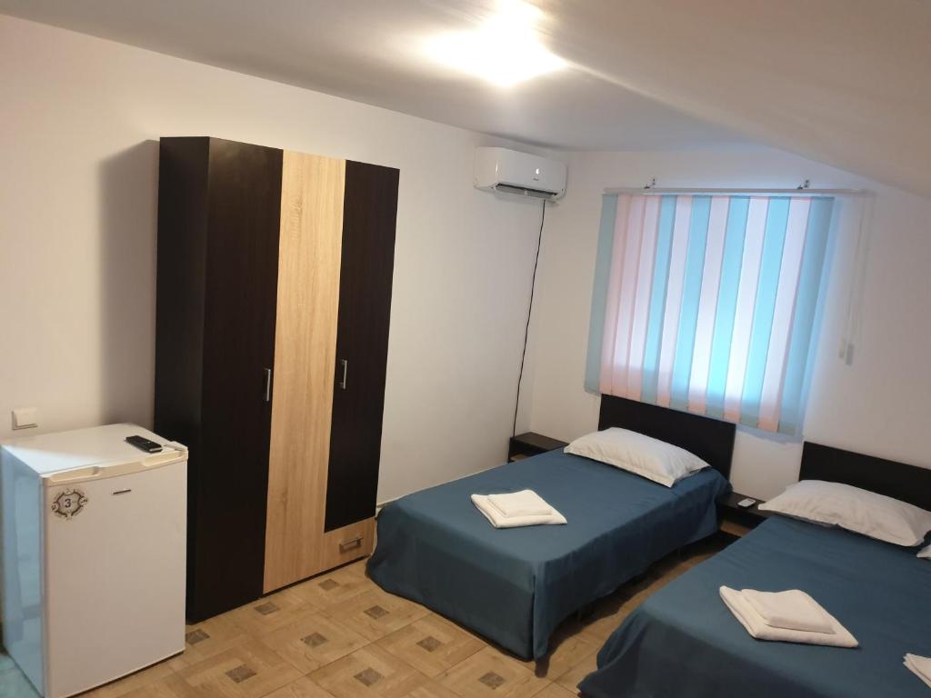 Postel nebo postele na pokoji v ubytování DMS Family House