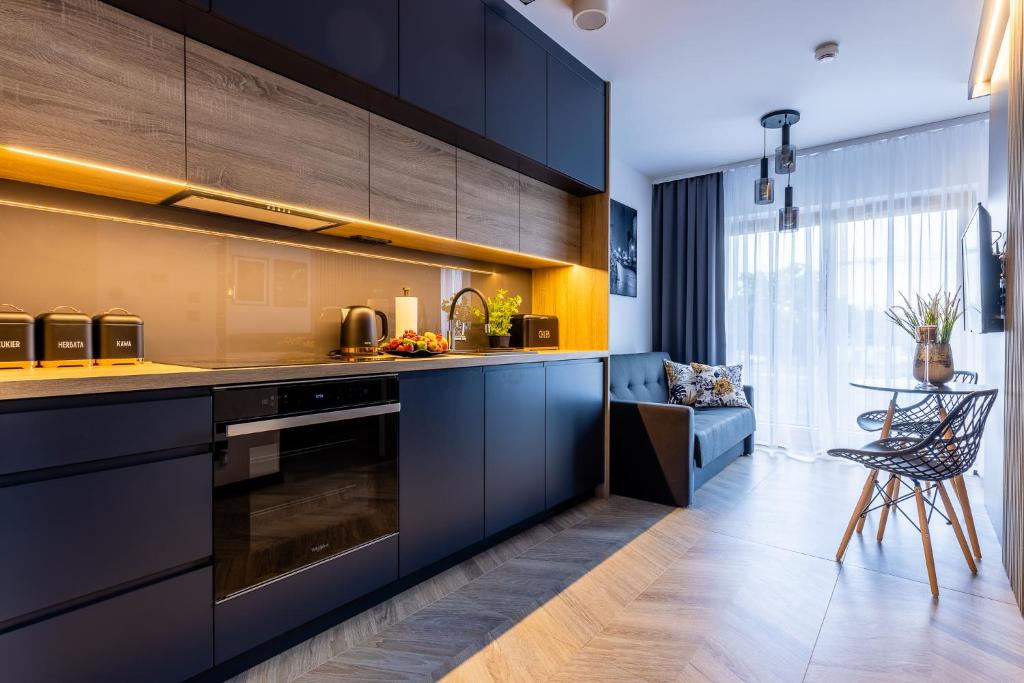 Kuchyňa alebo kuchynka v ubytovaní Apartament Nadmotławie 34