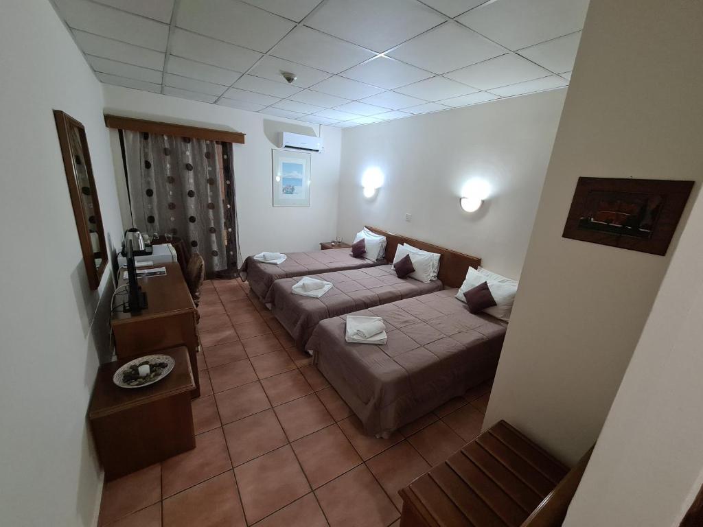 Postel nebo postele na pokoji v ubytování Metropole Hotel
