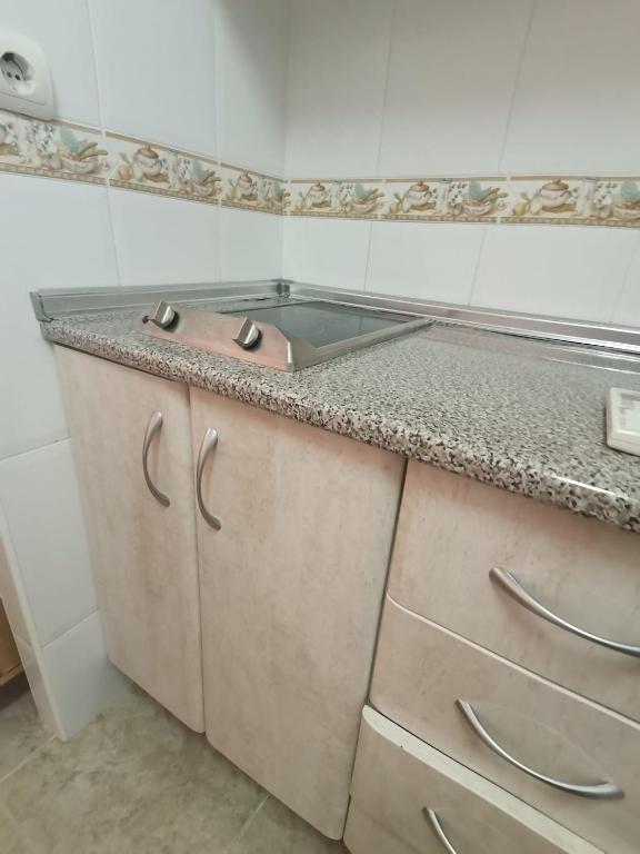 Kuchyň nebo kuchyňský kout v ubytování Apartament puerto