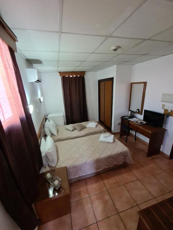 Postel nebo postele na pokoji v ubytování Metropole Hotel