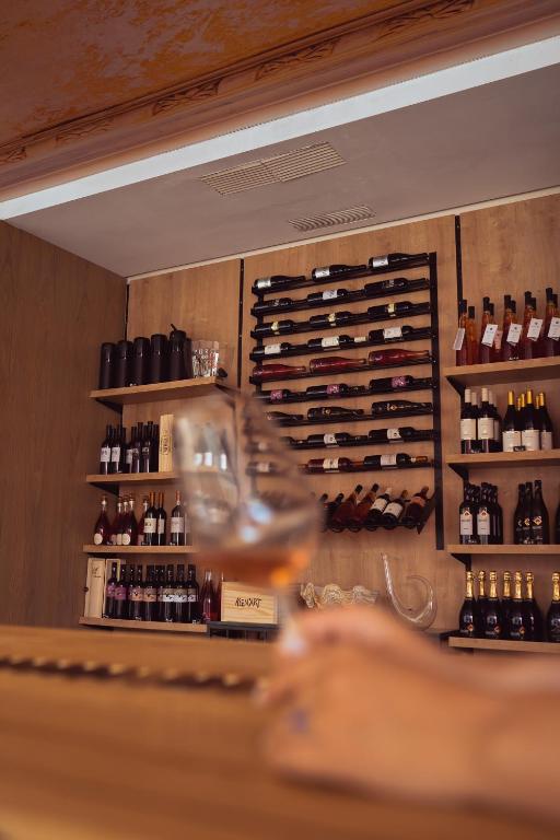 a wine cellar with shelves of wine bottles at Hotel Piran in Piran