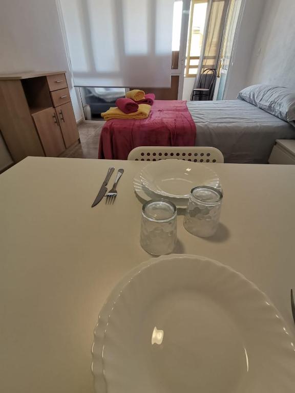 Postel nebo postele na pokoji v ubytování Apartament puerto