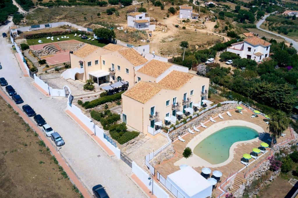 an aerial view of a villa with a swimming pool at Baglio Dello Zingaro in Scopello