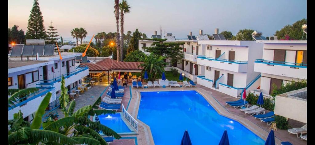 an aerial view of a hotel with a swimming pool at Giovanni Apartment 21 Kos in Kos