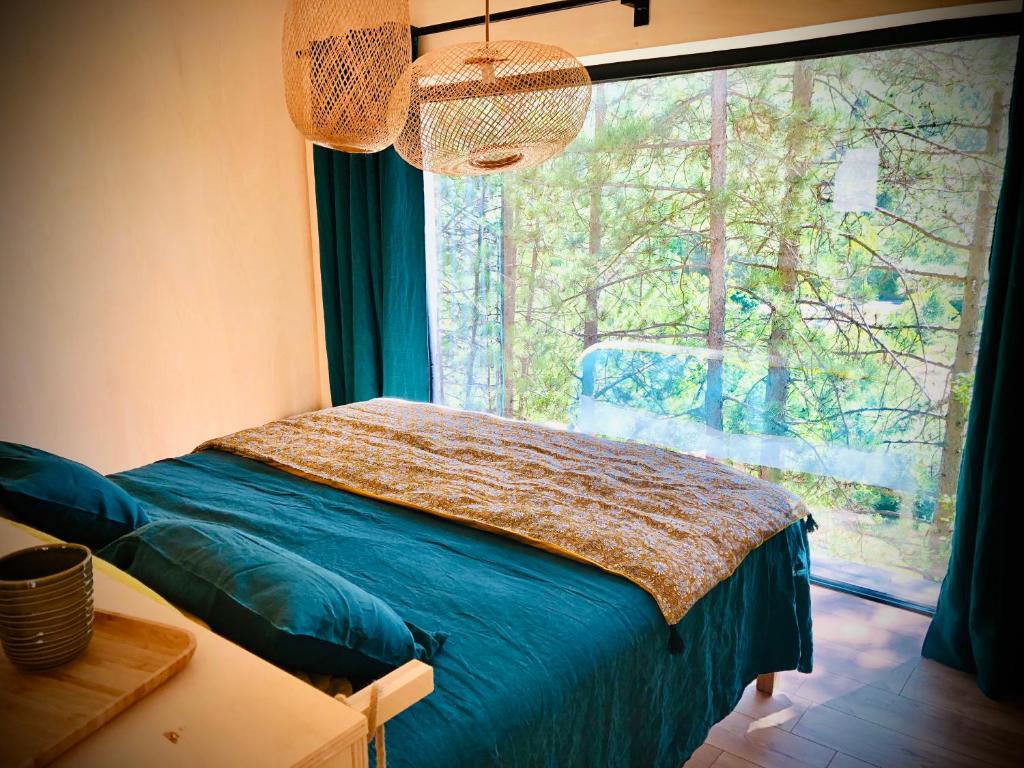 Postel nebo postele na pokoji v ubytování La Parenthèse