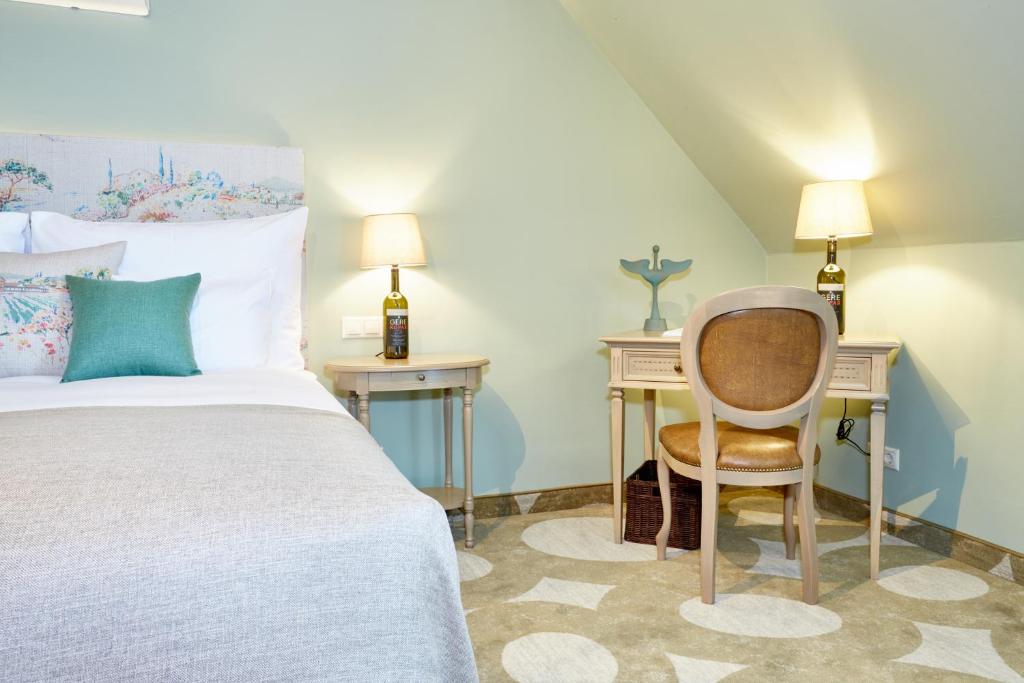 Łóżko lub łóżka w pokoju w obiekcie Crocus Gere Bor Hotel Resort & Wine Spa