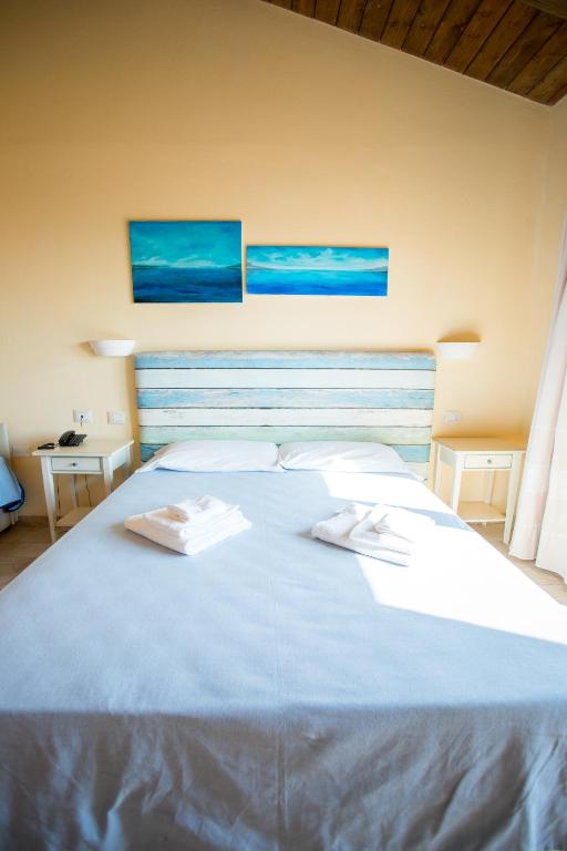 Postel nebo postele na pokoji v ubytování Hotel Costa Paradiso