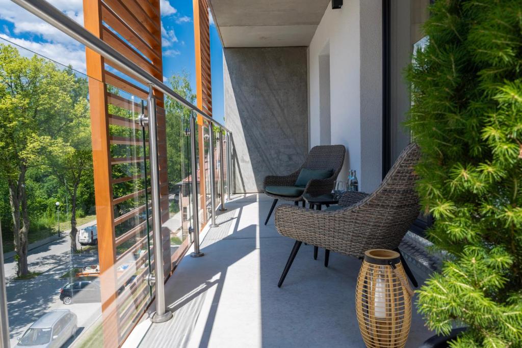 A balcony or terrace at Apartament Green Park, Polanica Residence garaż podziemny w cenie & mini SPA & Rowery