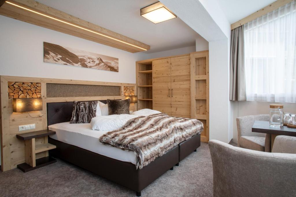 Posteľ alebo postele v izbe v ubytovaní Hotel Victoria