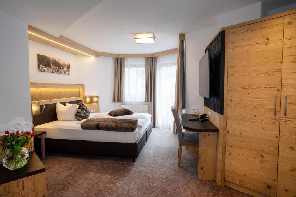 Posteľ alebo postele v izbe v ubytovaní Hotel Victoria