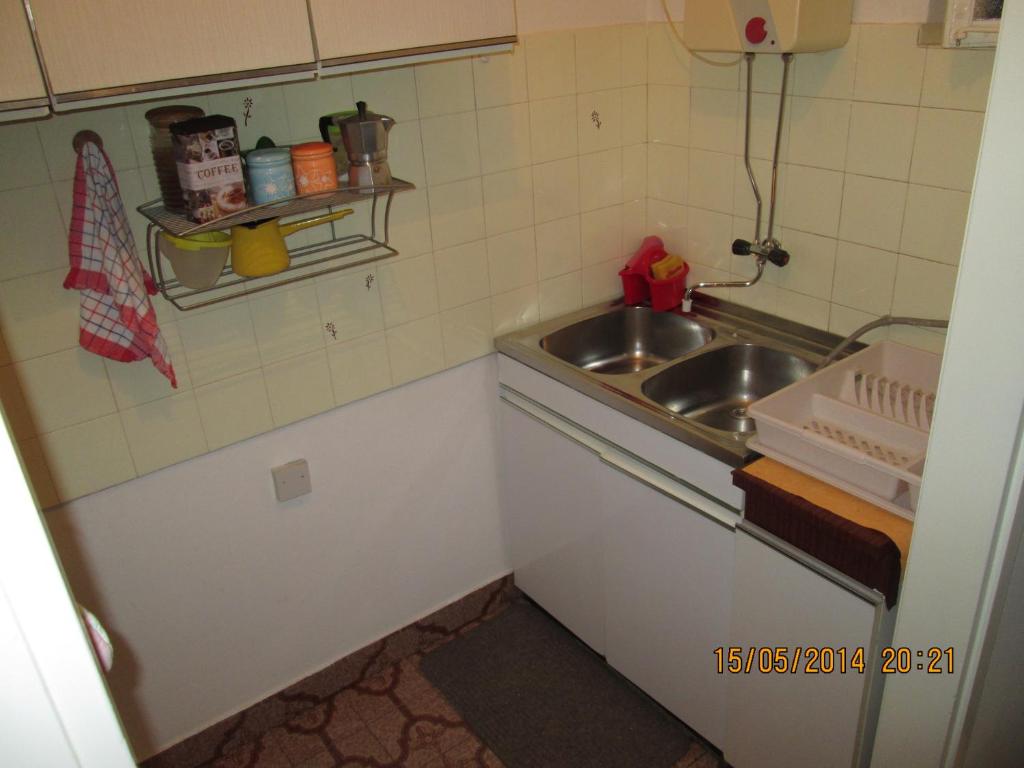 Kuchyňa alebo kuchynka v ubytovaní Apartment Sendy