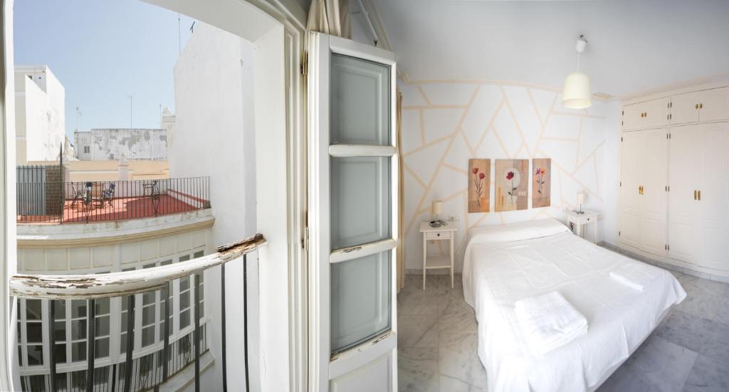 Ένα ή περισσότερα κρεβάτια σε δωμάτιο στο Caminito del Falla III Ha Apartment