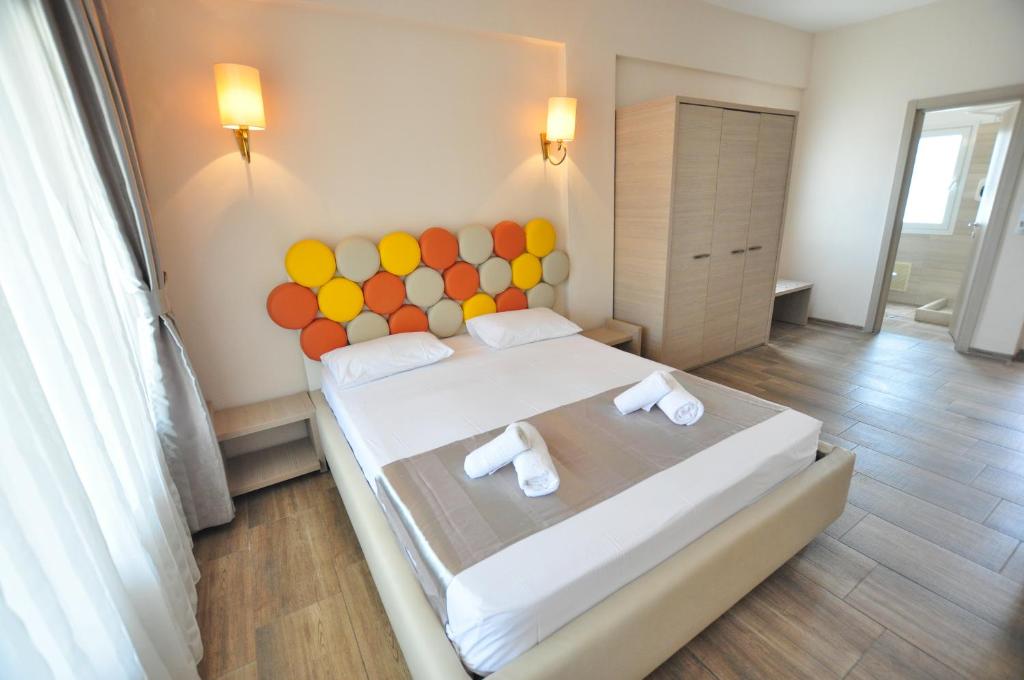 Postel nebo postele na pokoji v ubytování Michelangelo Resort