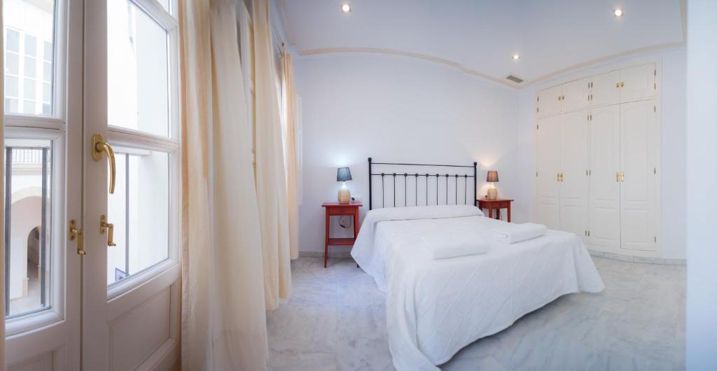Кровать или кровати в номере Caminito del Falla I Ha Apartment