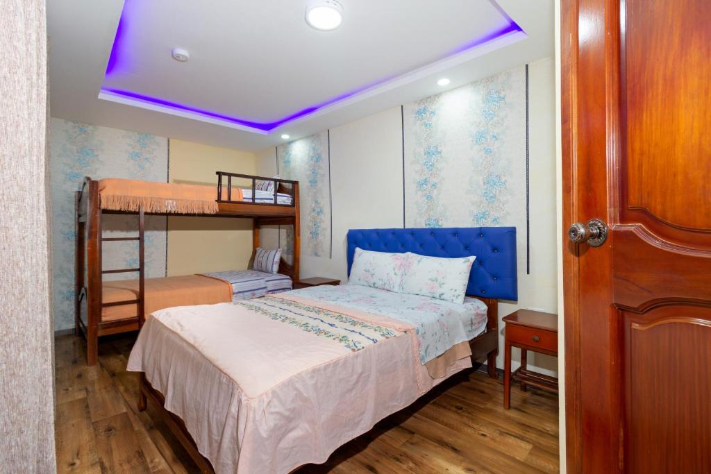 Postel nebo postele na pokoji v ubytování Hostal Rossy