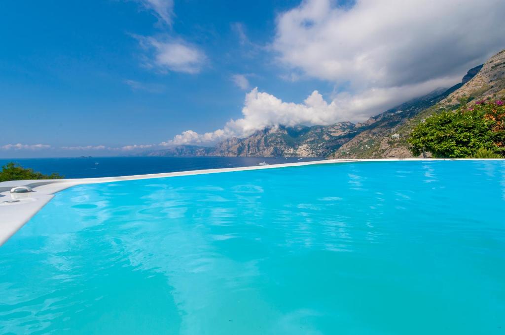 a swimming pool with a view of the mountains at Villa Panorama in Praiano