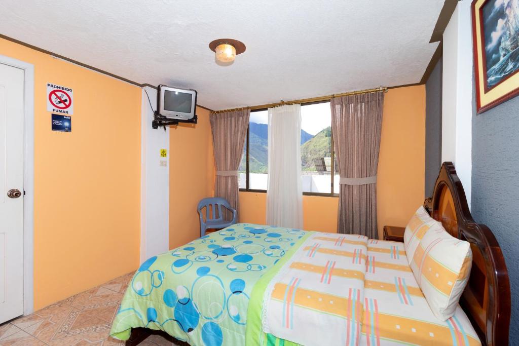 Postel nebo postele na pokoji v ubytování Hostal Rossy