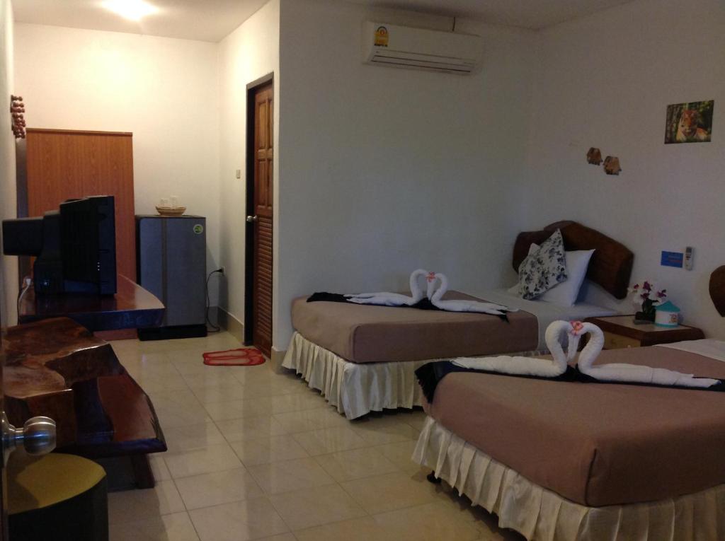 Postel nebo postele na pokoji v ubytování Ruan Mai San Ngam Resort - SHA Plus