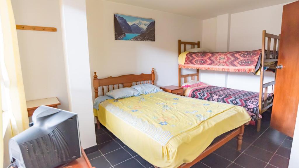 Postel nebo postele na pokoji v ubytování Hostal Ñaña