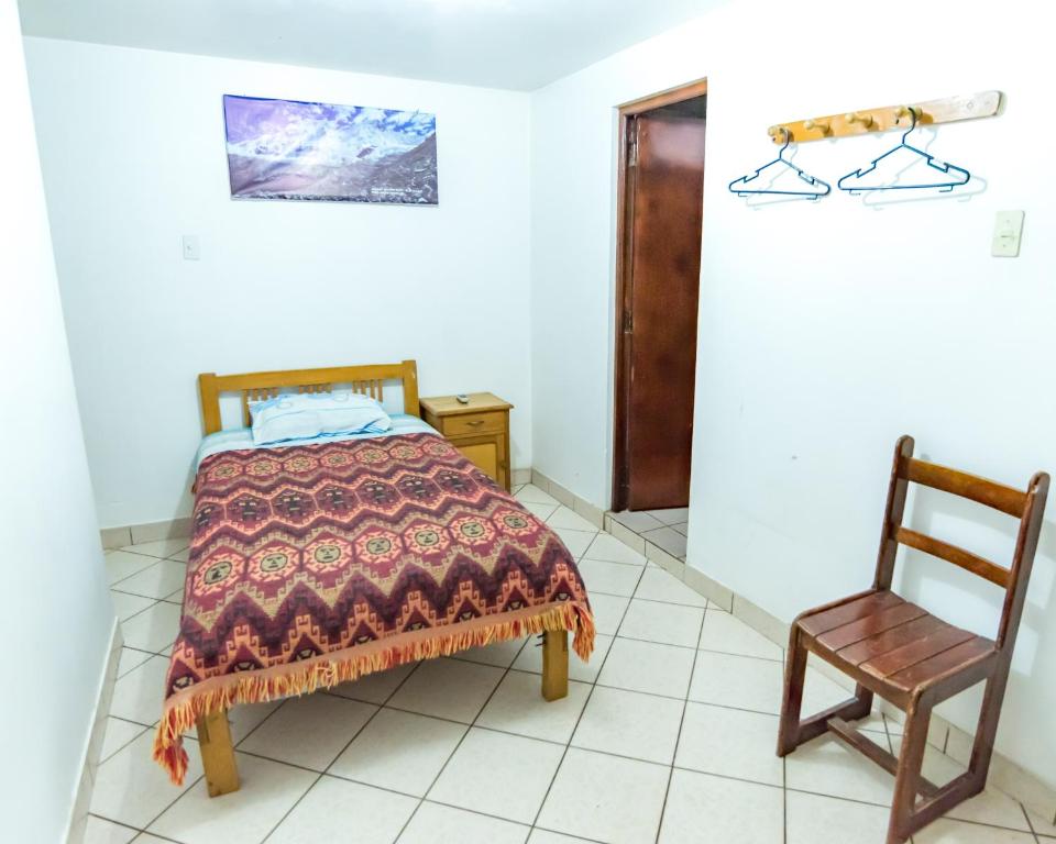 Postel nebo postele na pokoji v ubytování Hostal Ñaña