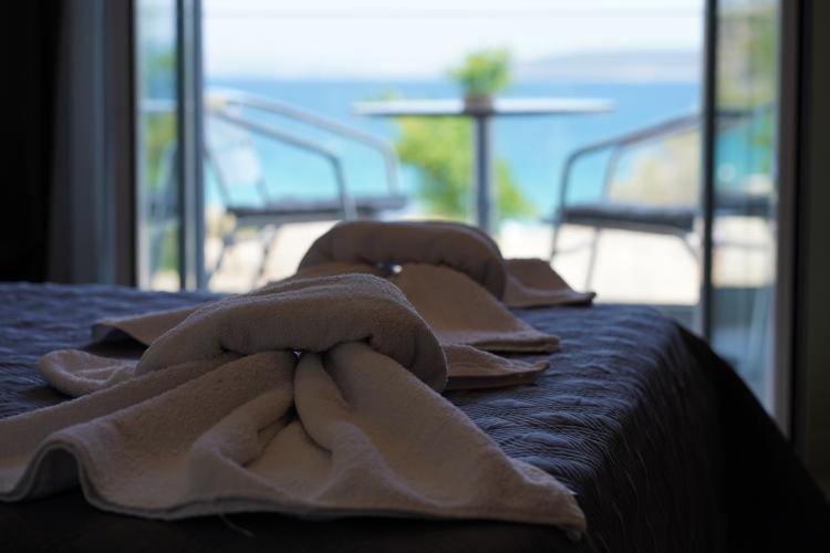Postel nebo postele na pokoji v ubytování ANGELO Cafe Hotel