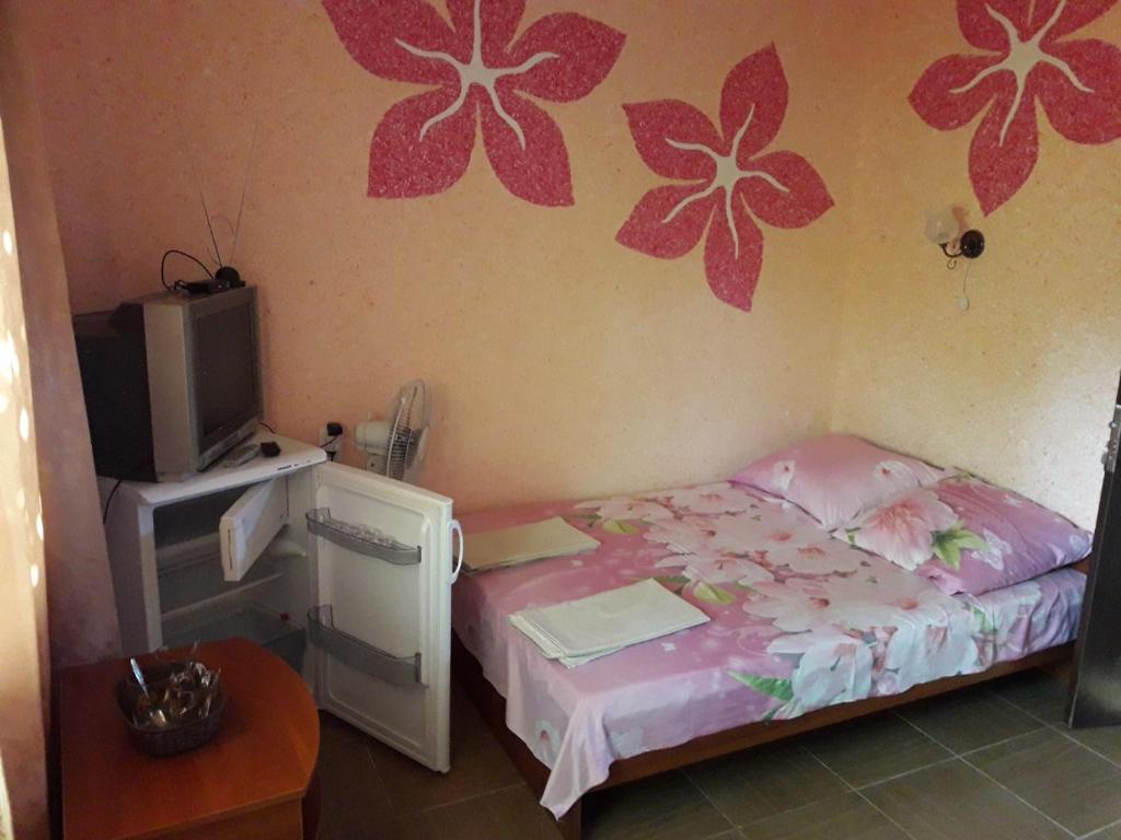 Łóżko lub łóżka w pokoju w obiekcie Гостевой дом на Лисках