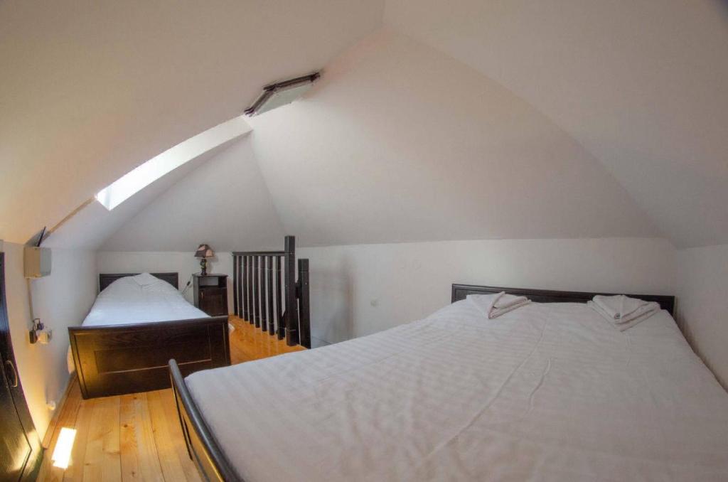 a bedroom with two beds in a attic at Vila Darija Zlatar - studio apartman br. 3 in Nova Varoš