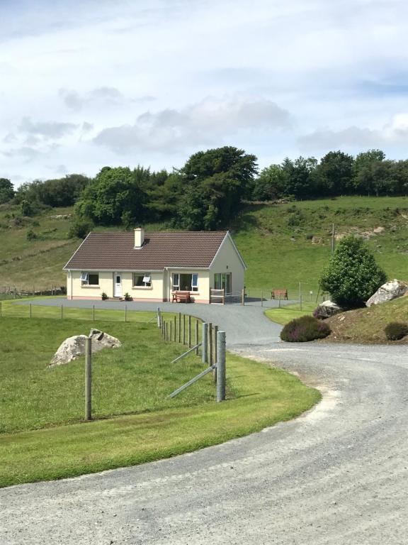 a house on the side of a road at Heather Cottage, Creeslough in Creeslough