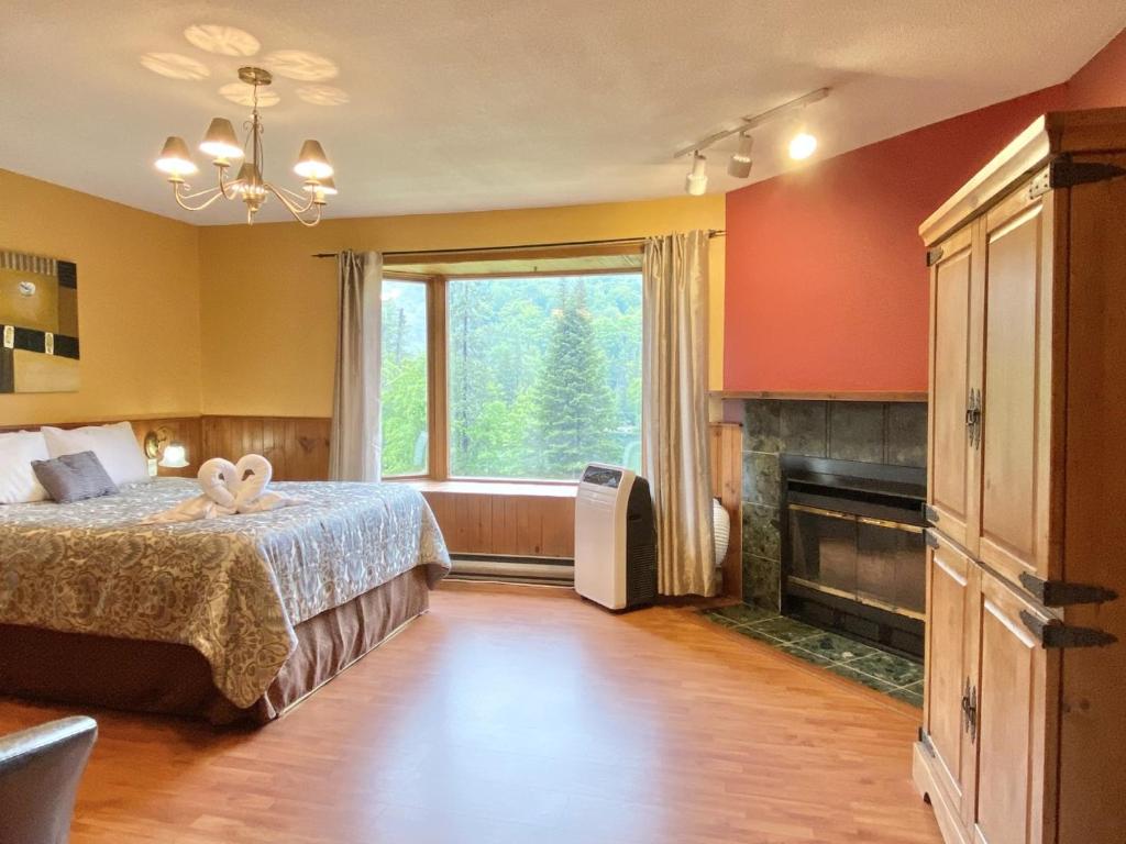 Postel nebo postele na pokoji v ubytování Hôtel du lac Lenore