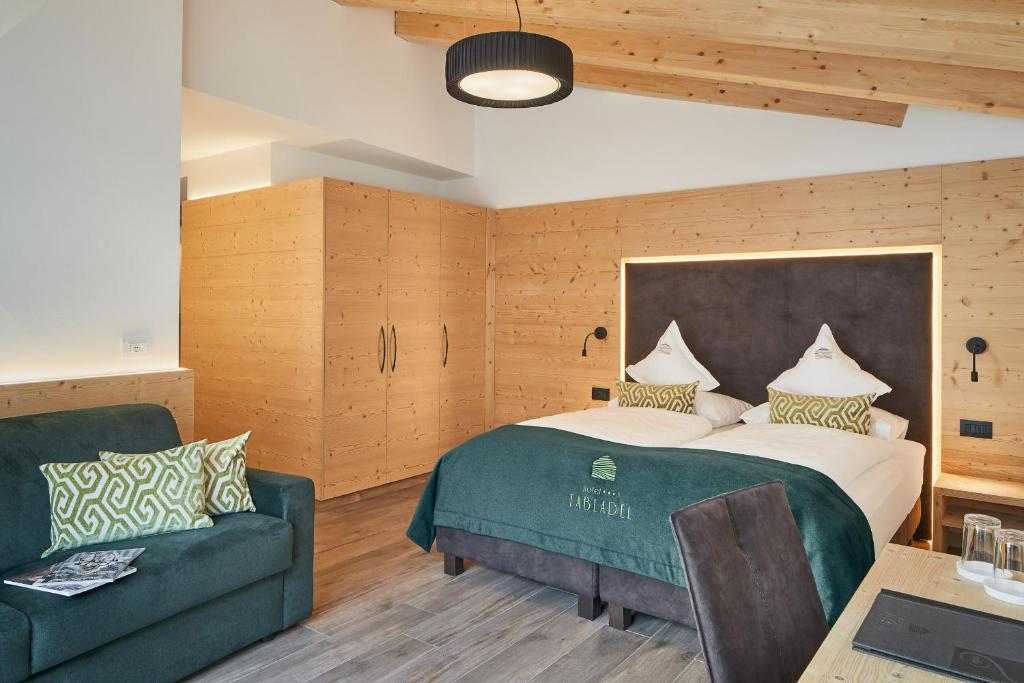 Postel nebo postele na pokoji v ubytování Hotel Tabladel