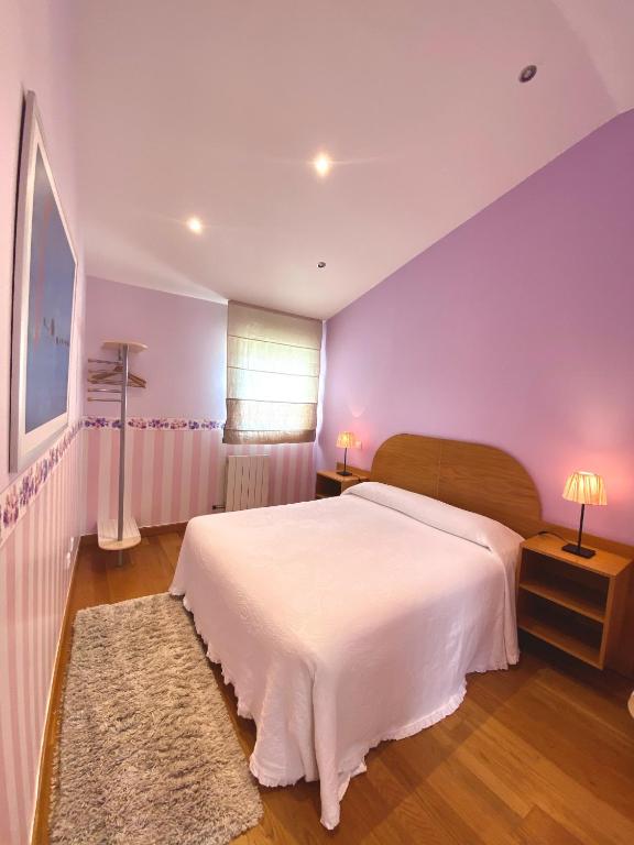 A bed or beds in a room at Apartamento Turistico Plaza Mayor