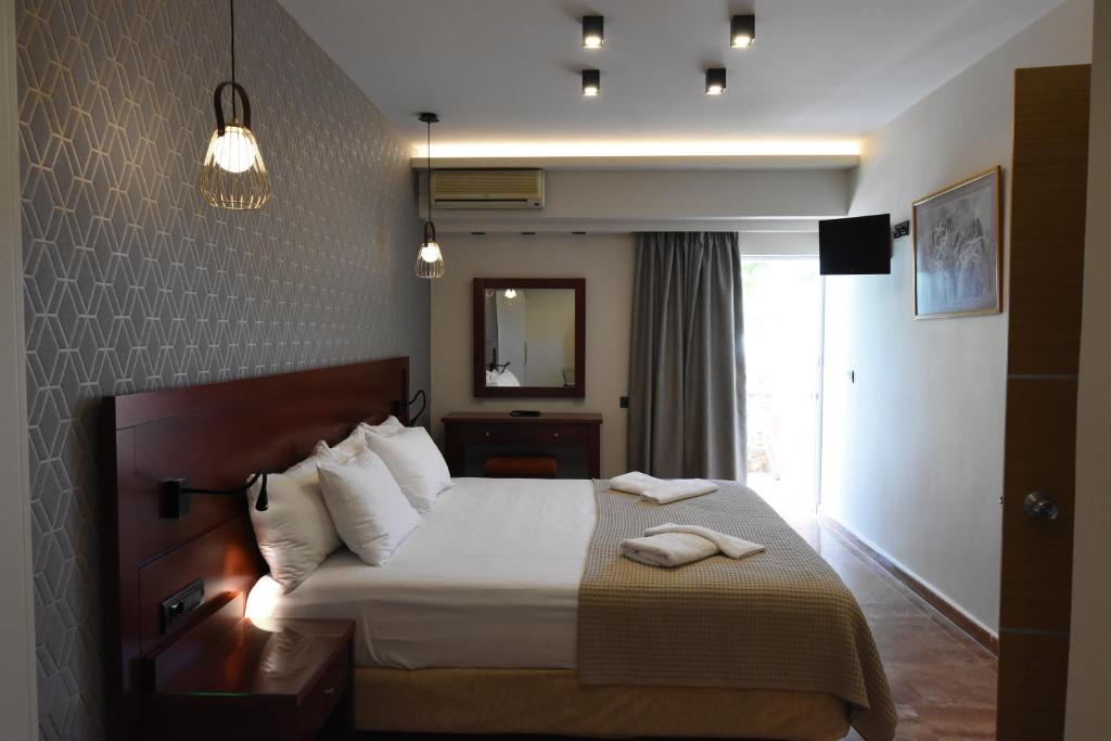 Posteľ alebo postele v izbe v ubytovaní Viaros Hotel Apartments